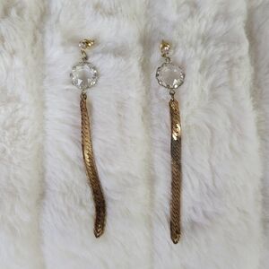 BOUTIQUE // brass snake like drop chain earrings with clear gem detail